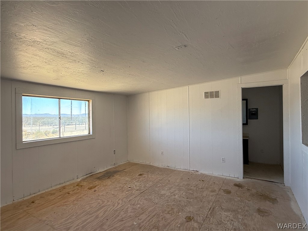 8051 7th Street Dolan Springs, AZ 86441 - Photo 12 of 65 an empty room with windows