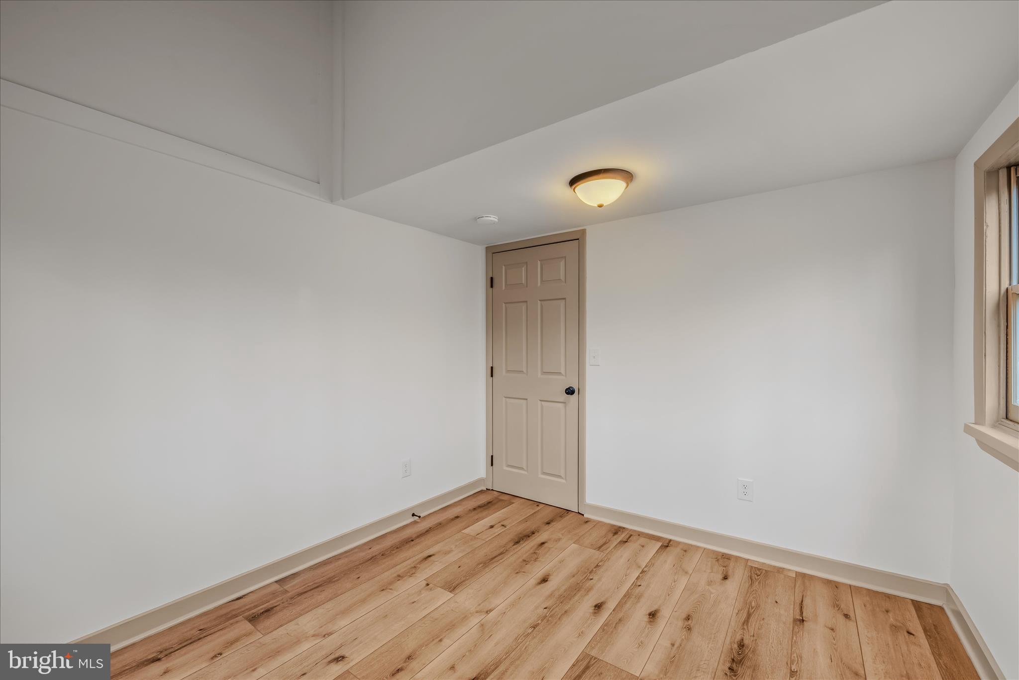 495 Getaway Road Hedgesville, WV 25427 - Photo 16 of 44 a view of room with wooden floor and fan