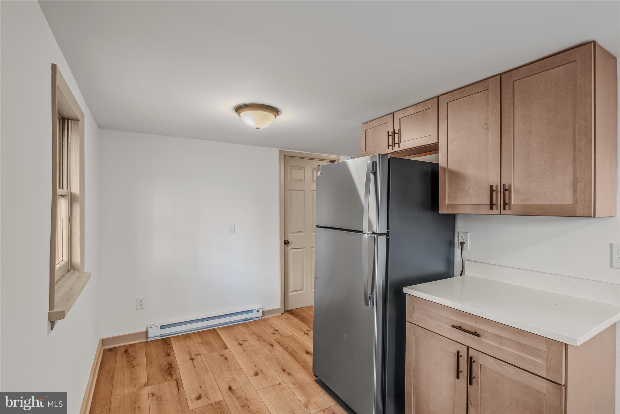 495 Getaway Road Hedgesville, WV 25427 - Photo 20 of 44 a kitchen with a refrigerator and a sink