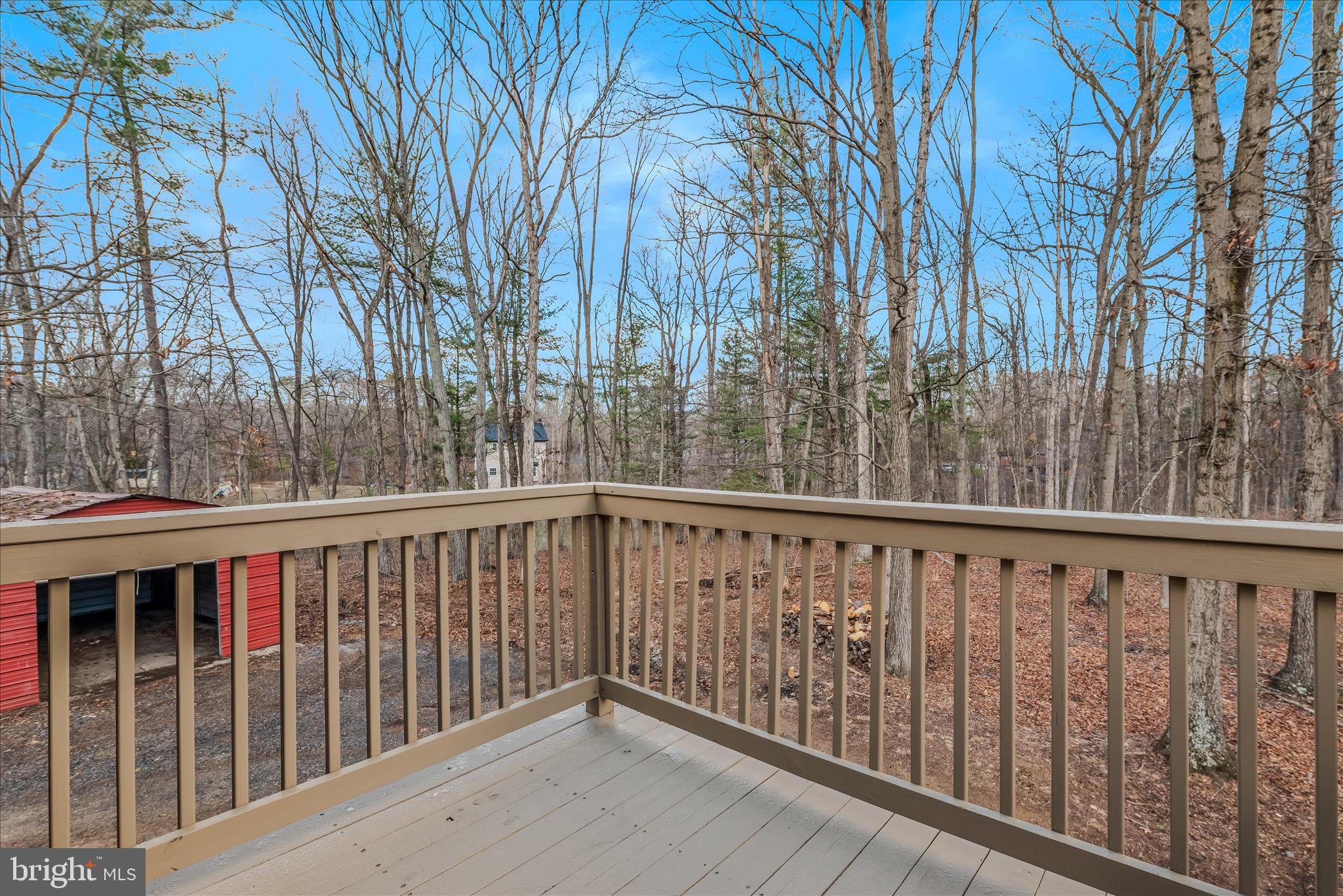 495 Getaway Road Hedgesville, WV 25427 - Photo 28 of 44 a view of deck with large trees