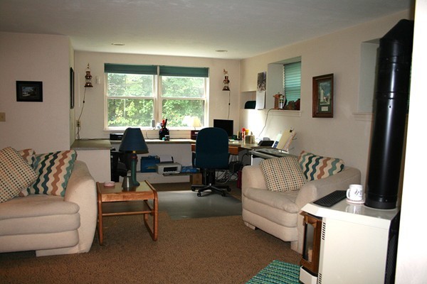 23 Highfield Road, Unit D Charlton, MA 01507 - Photo 13 of 24 a living room with furniture and a large window