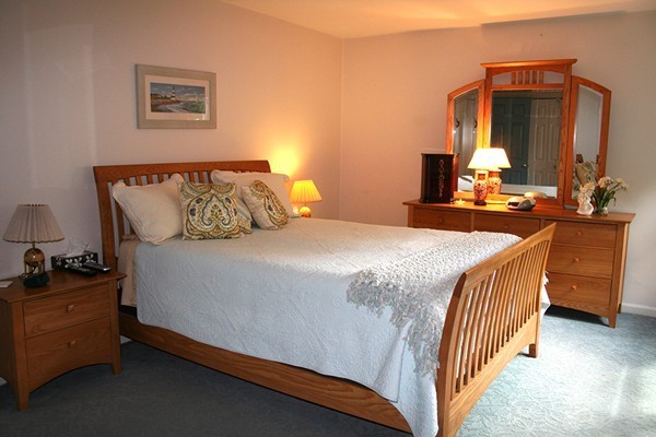 23 Highfield Road, Unit D Charlton, MA 01507 - Photo 18 of 24 a bedroom with a bed and dresser