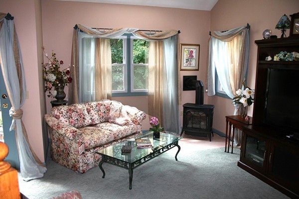 23 Highfield Road, Unit D Charlton, MA 01507 - Photo 7 of 24 a living room with furniture and a window
