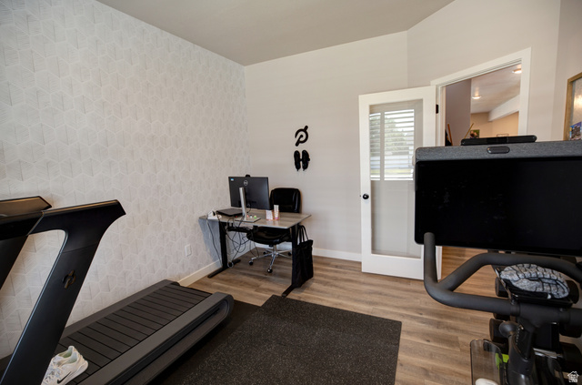 983 South 950 West Provo, UT 84601 - Photo 26 of 56 Versatile room featuring wood-finish flooring and a geometrically patterned accent wall