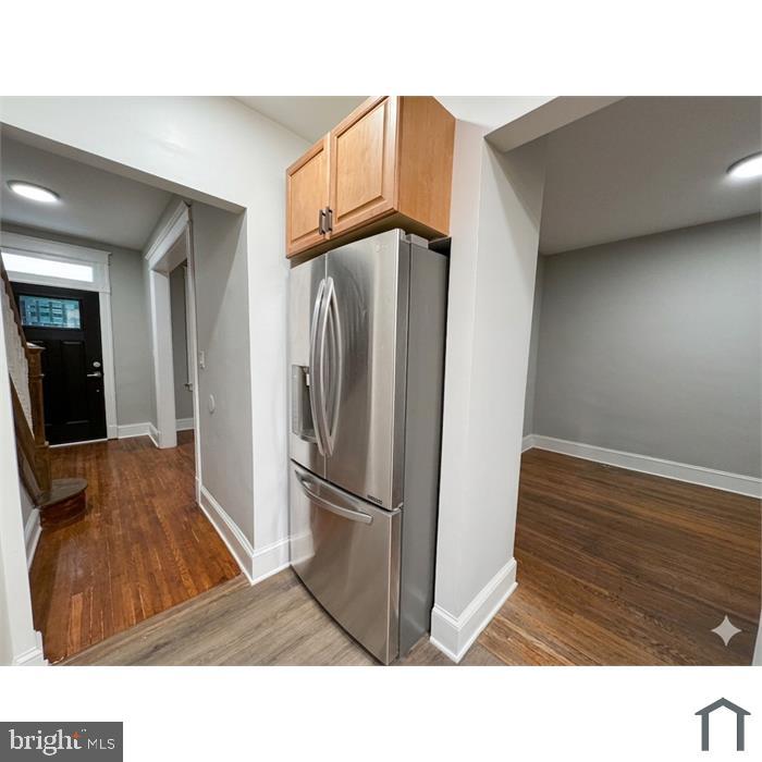 303 Webster Street Northwest Washington, DC 20011 - Photo 7 of 16 Modern kitchen entryway with sleek fridge.
