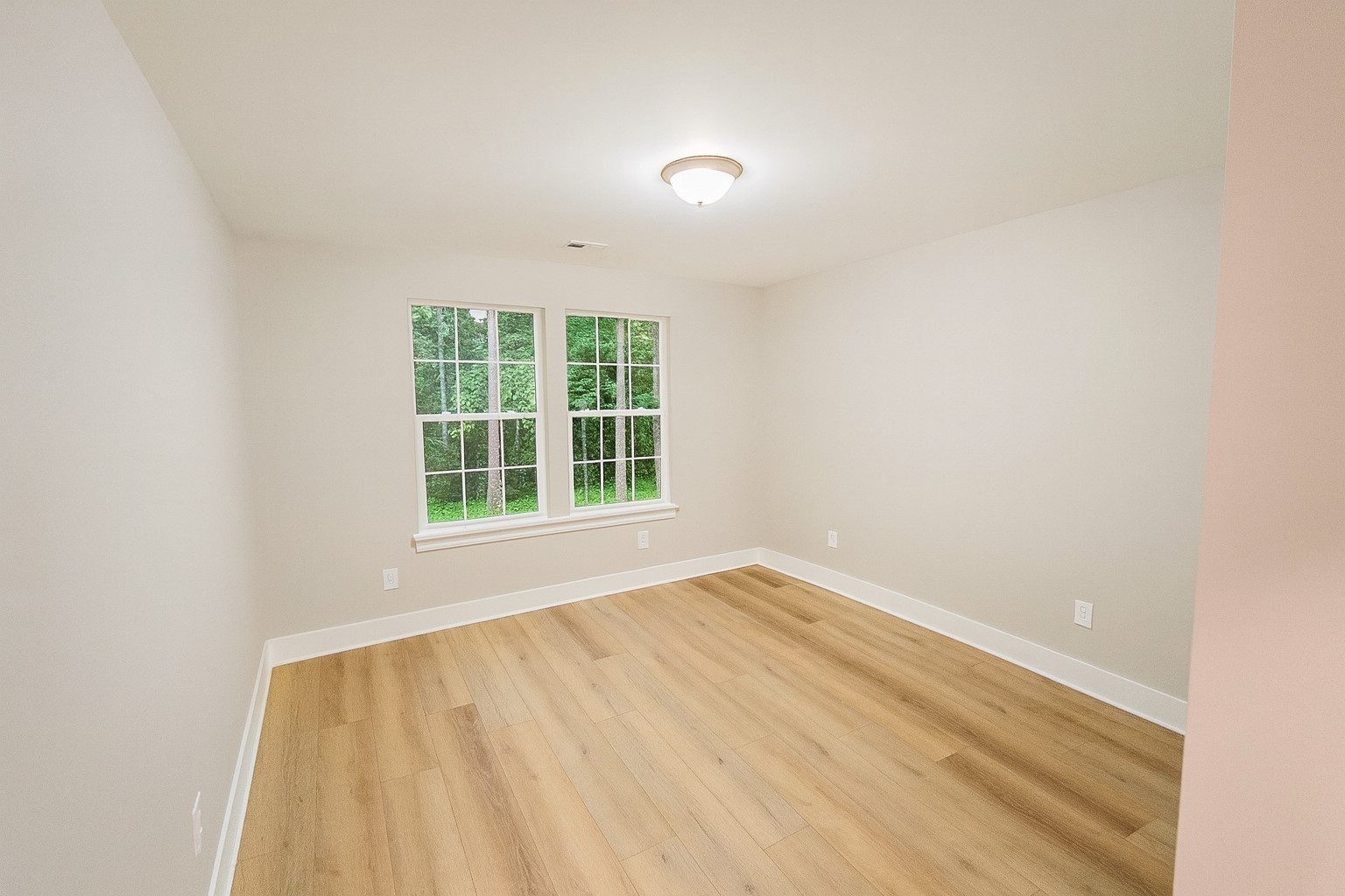 810 Lucas Road Dickson, TN 37055 - Photo 23 of 37 an empty room with wooden floor and windows