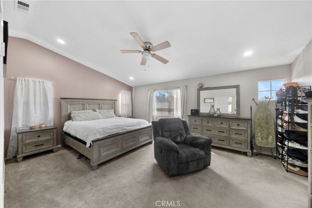 1494 Rabbit Peak Way Hemet, CA 92545 - Photo 23 of 45 a bedroom with a bed and a couch