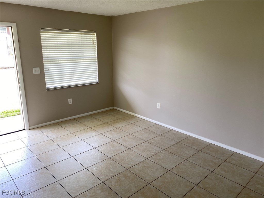 3325 Airport Road North, Unit L2 Naples, FL 34105 - Photo 3 of 14 a view of an empty room with a window