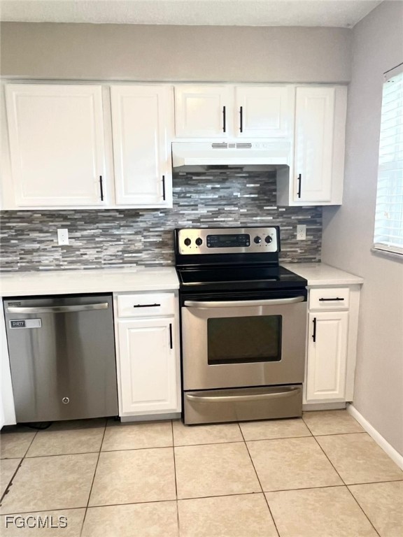 3325 Airport Road North, Unit L2 Naples, FL 34105 - Photo 8 of 14 a kitchen with cabinets and appliances