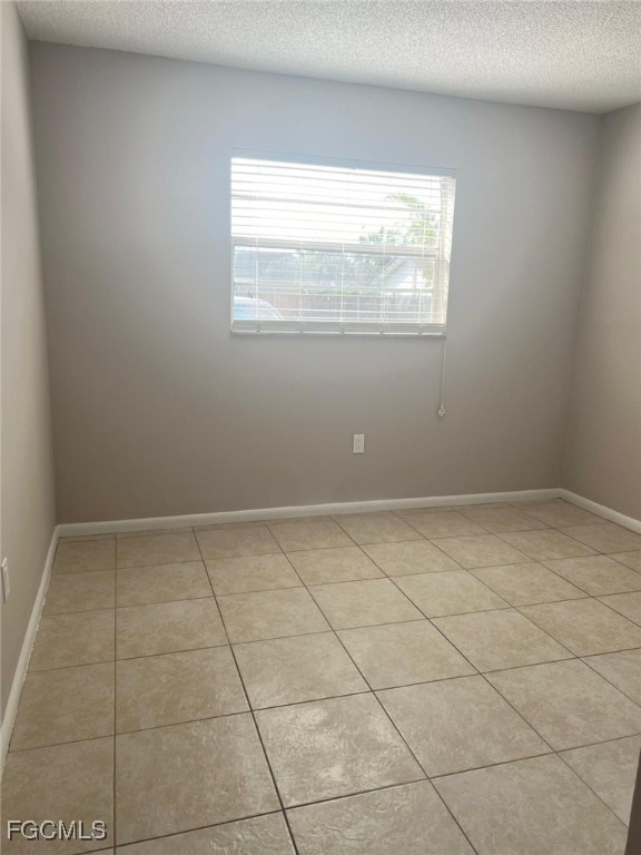3325 Airport Road North, Unit L2 Naples, FL 34105 - Photo 10 of 14 a view of an empty room and a window