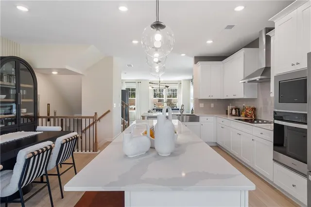 a view of kitchen with sink and breakfast area