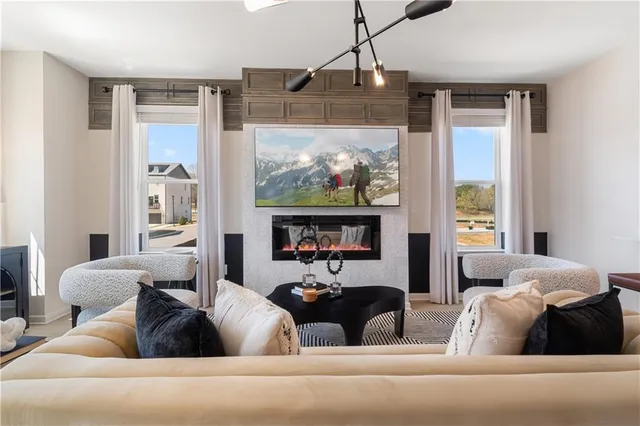 a living room with furniture and a large window