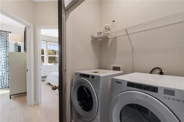 a bedroom with bed and a large window