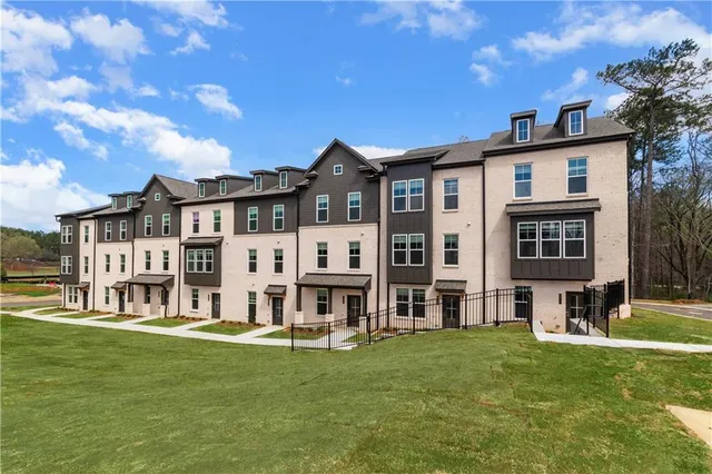 a view of a big yard with a big yard and large trees