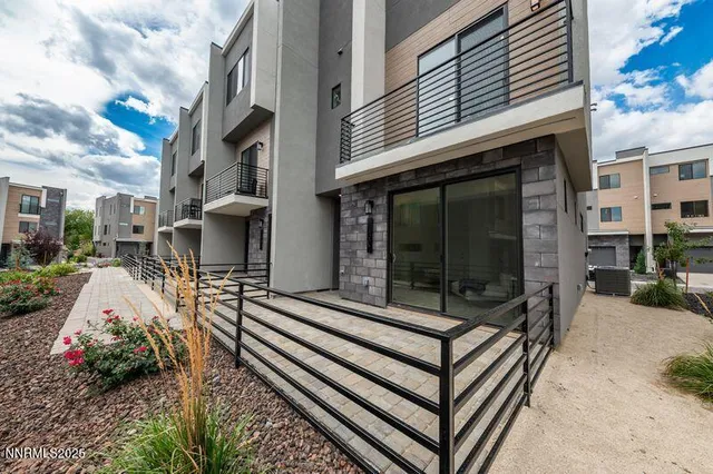 a view of a patio with a table and chairs