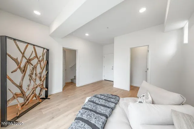 a bedroom with a bed and a couch