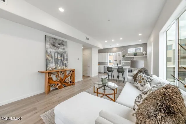 a living room with furniture and a table