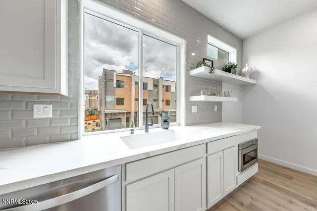 a kitchen with a sink and cabinets