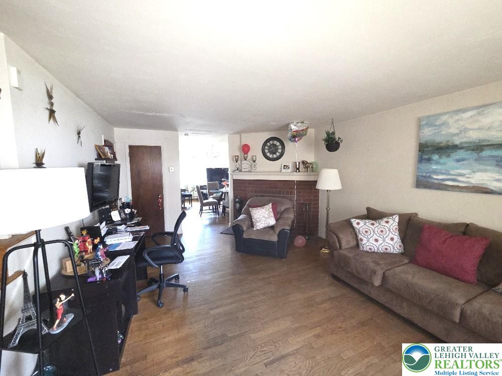 41 South 4th Street Allentown, PA 18102 - Photo 2 of 19 a living room with furniture and a fireplace