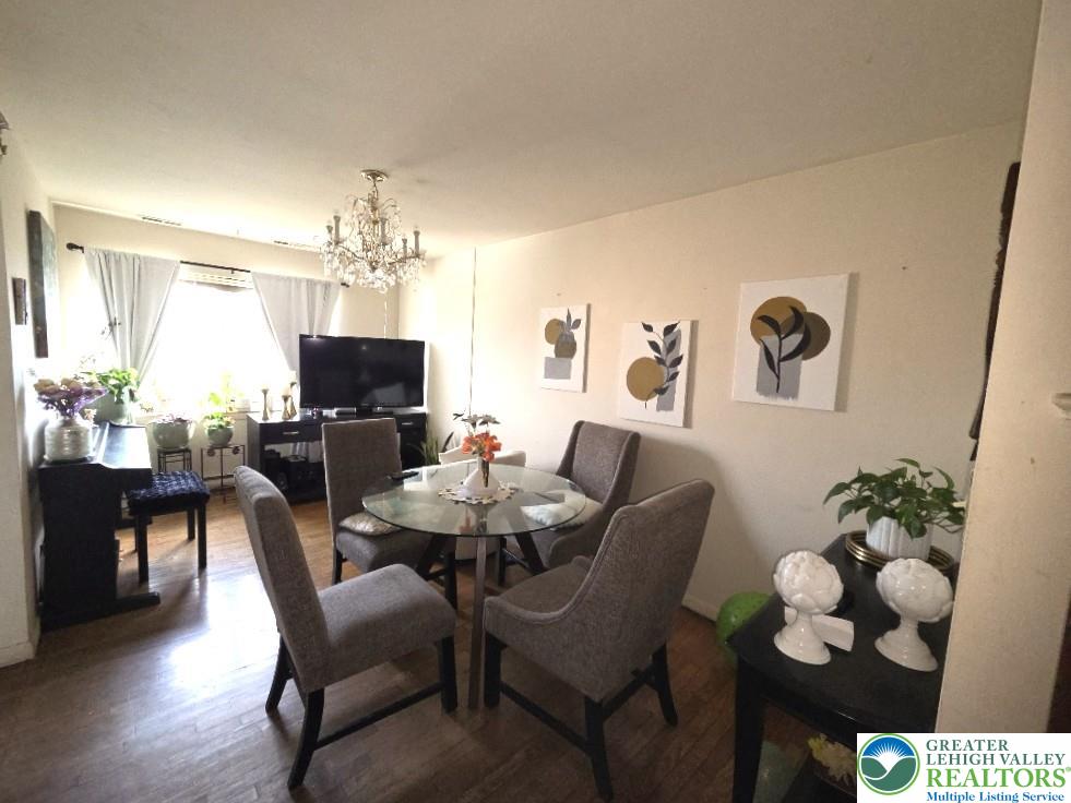 41 South 4th Street Allentown, PA 18102 - Photo 5 of 19 a view of a dining room with furniture and chandelier