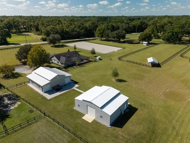 a view of a swimming pool with a yard
