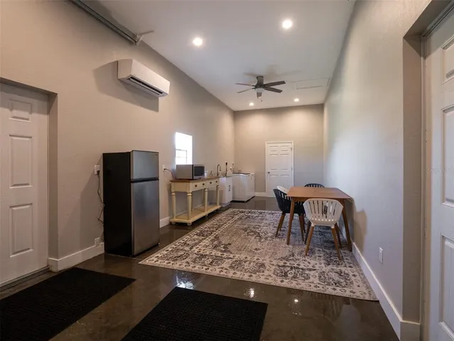 a bathroom with a sink toilet vanity and window