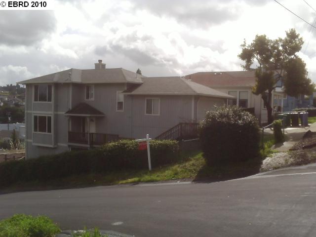 601 Lake Avenue Rodeo, CA 94572 - Photo 1 of 1 a front view of a house with a yard