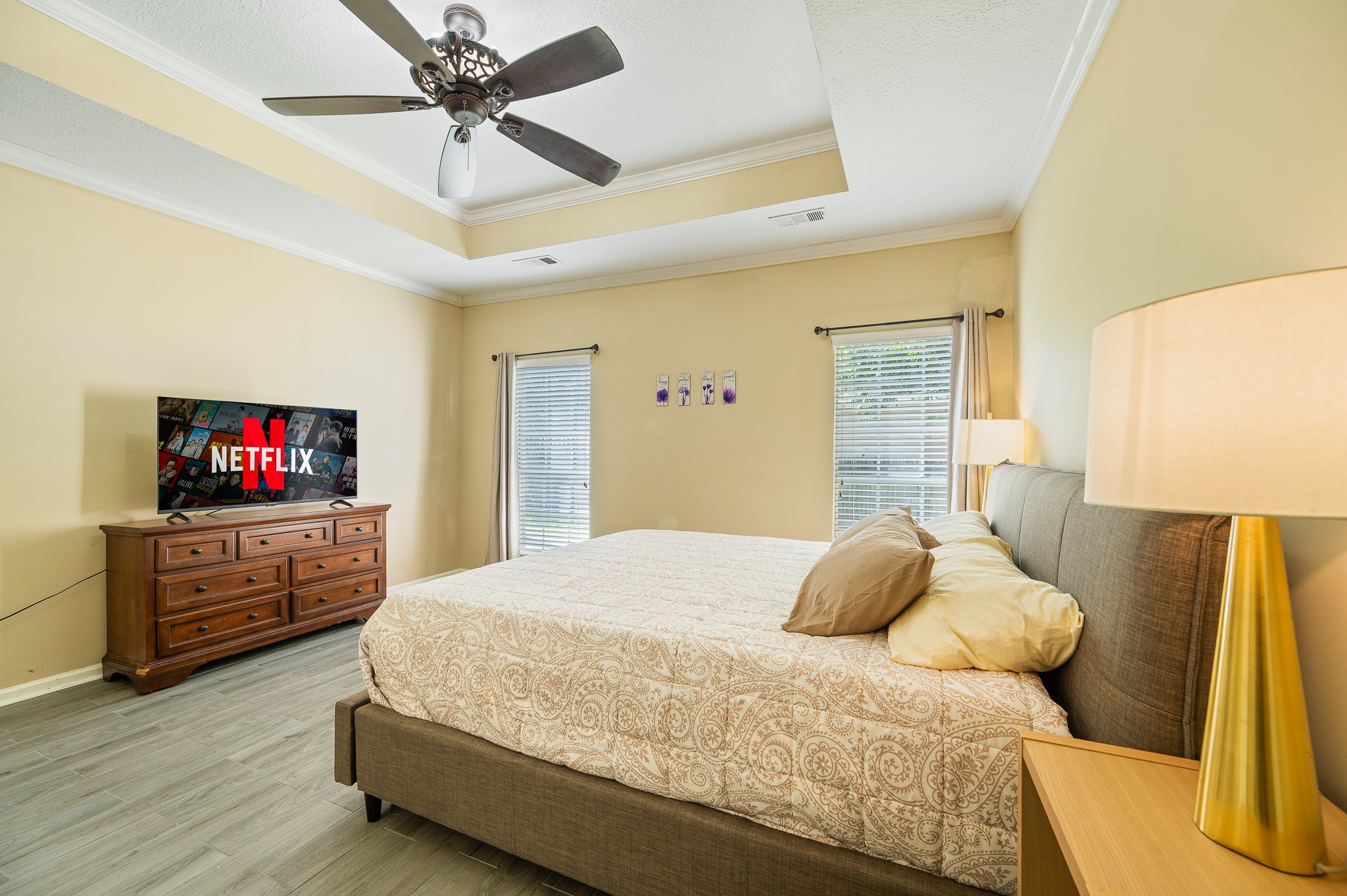 8111 Morningbrook Court Spring, TX 77379 - Photo 22 of 46 a bedroom with a bed and a flat screen tv