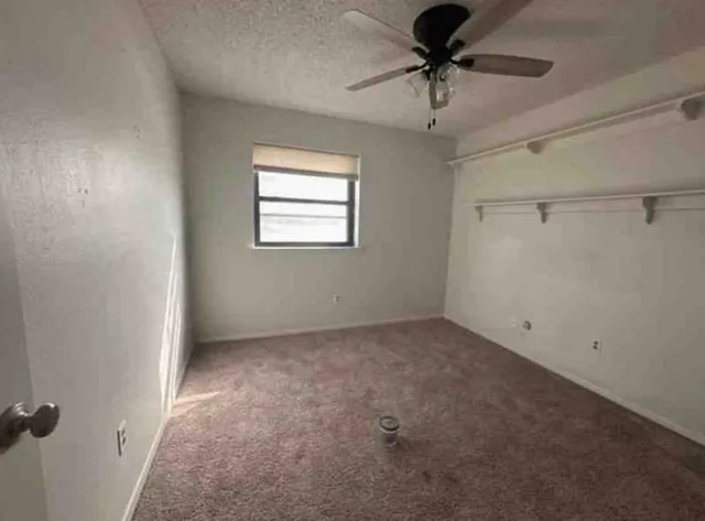 a view of a chandelier fan in a room