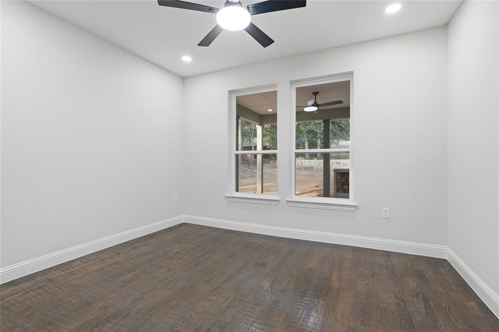 2150 Lakeview Mabank, TX 75156 - Photo 25 of 36 an empty room with a window and a ceiling fan