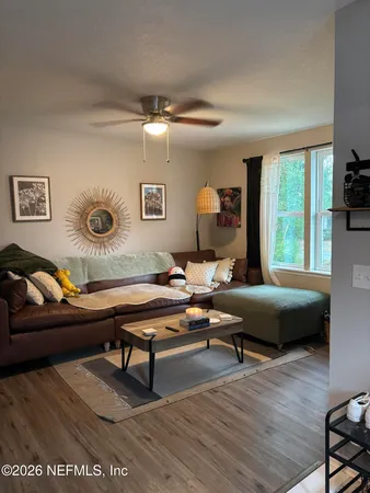 a living room with furniture and a table