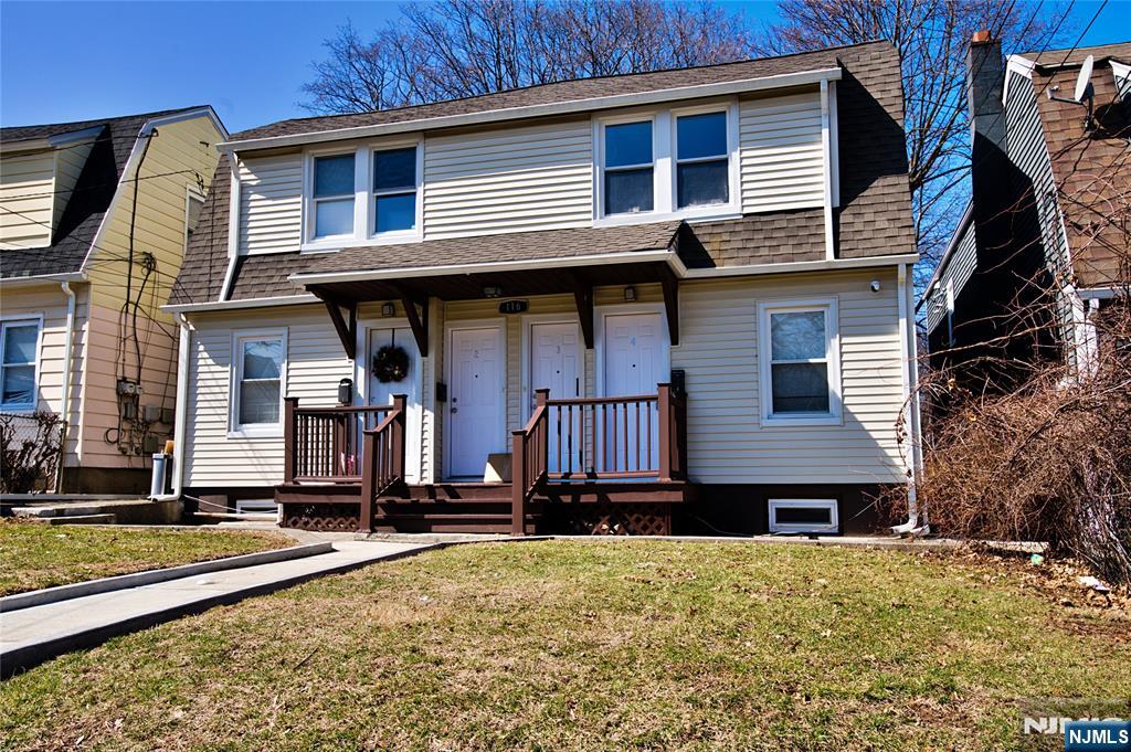 116 Maple Avenue, Unit 4 Montclair, NJ 07042 - Photo 1 of 14 a front view of a house with a yard