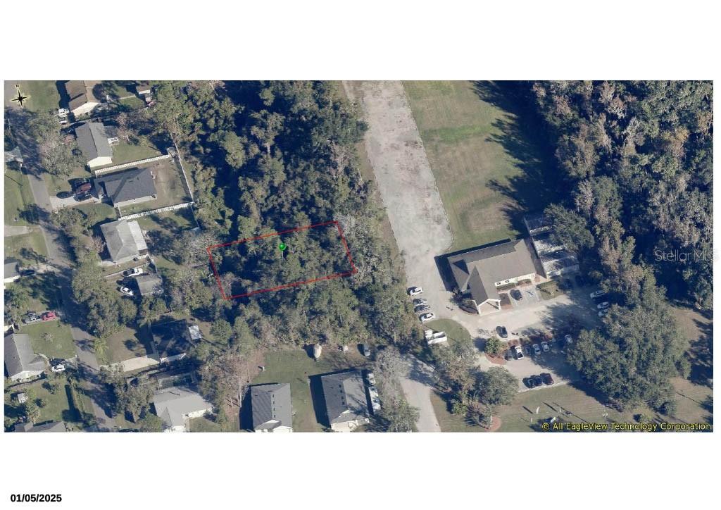 252 Acacia Road DeBary, FL 32713 - Photo 2 of 2 a black and white photo of a house