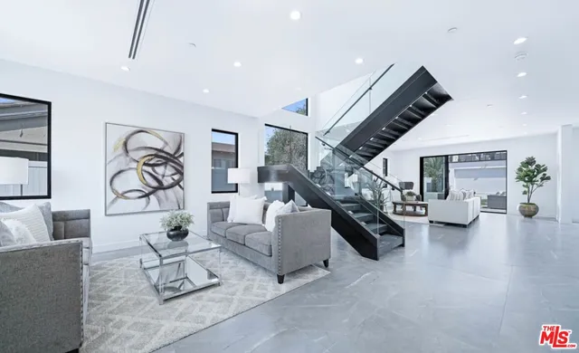 a living room with furniture and white walls