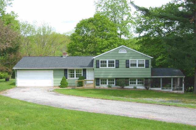 70 Limekiln Road Ridgefield, CT 06877 - Photo 1 of 1 a front view of a house with a yard