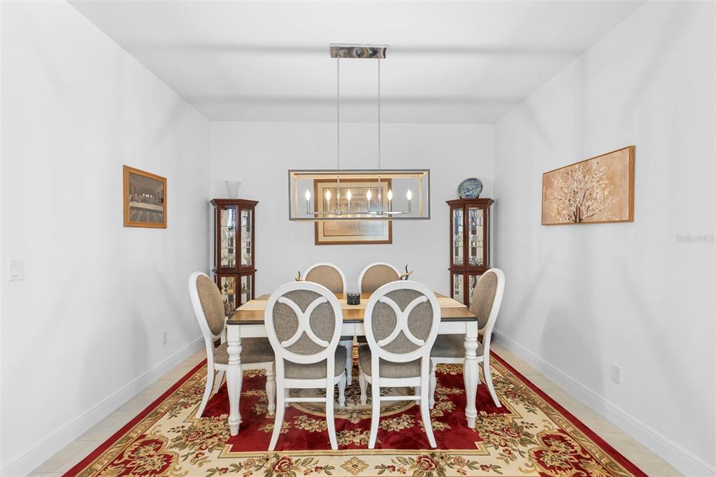 744 Hyperion Drive DeBary, FL 32713 - Photo 15 of 54 a view of a dining room with furniture