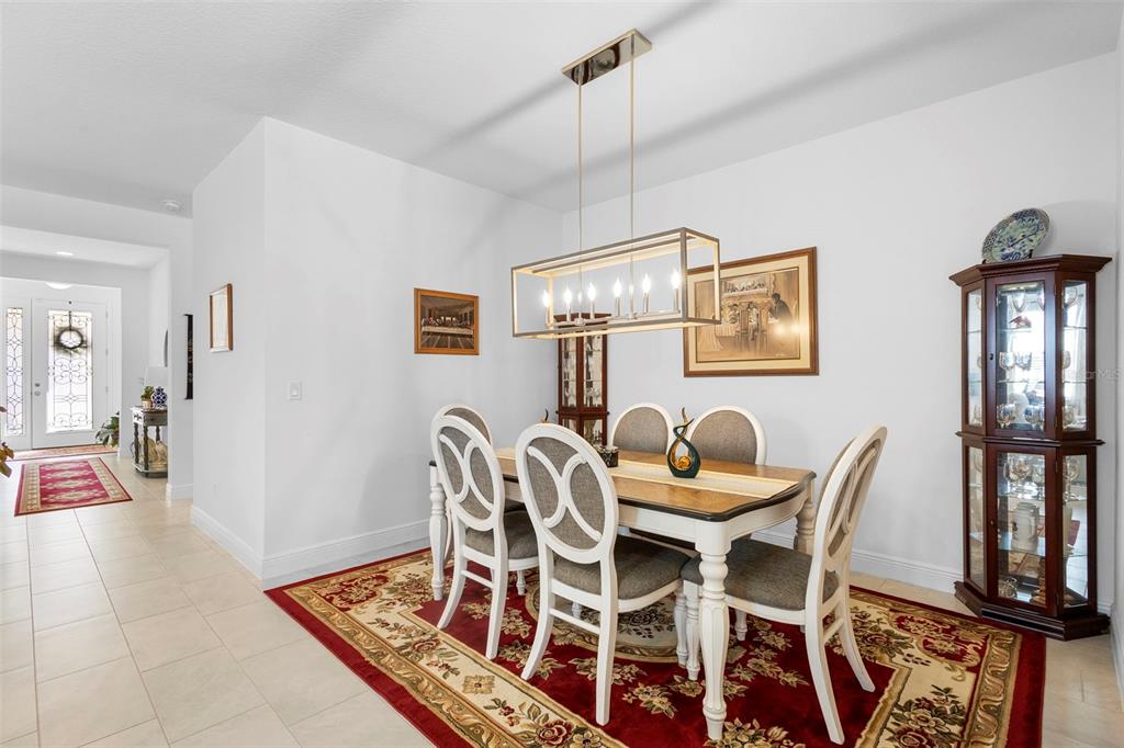 744 Hyperion Drive DeBary, FL 32713 - Photo 16 of 54 a dining room with furniture and window