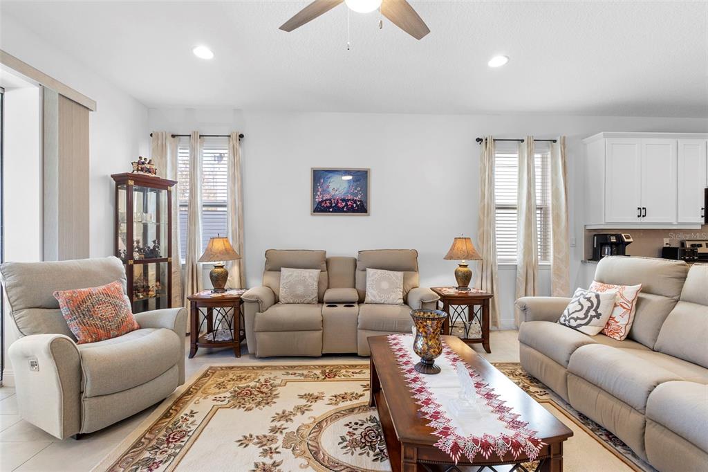 744 Hyperion Drive DeBary, FL 32713 - Photo 18 of 54 a living room with furniture ceiling fan and a window