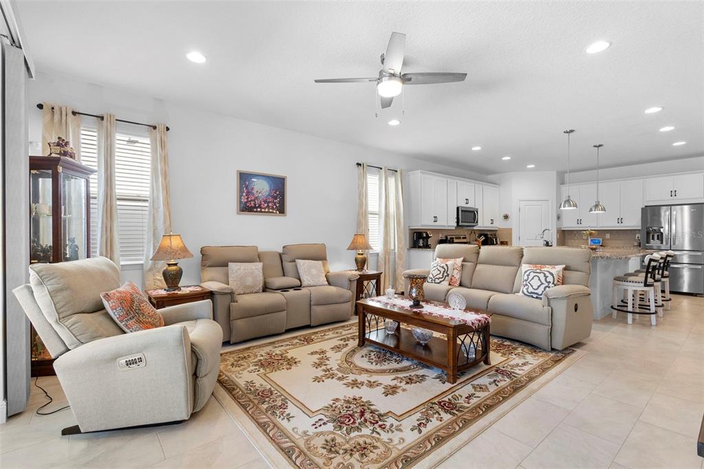 744 Hyperion Drive DeBary, FL 32713 - Photo 19 of 54 a living room with furniture a rug and a chandelier