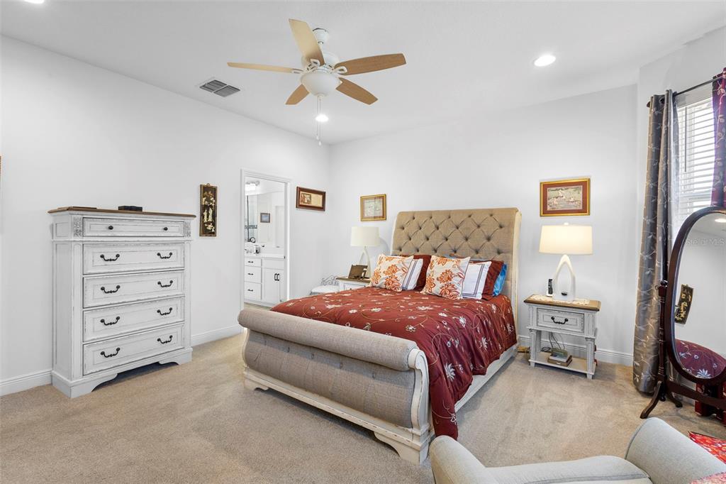 744 Hyperion Drive DeBary, FL 32713 - Photo 21 of 54 a bedroom with a bed and a cabinets