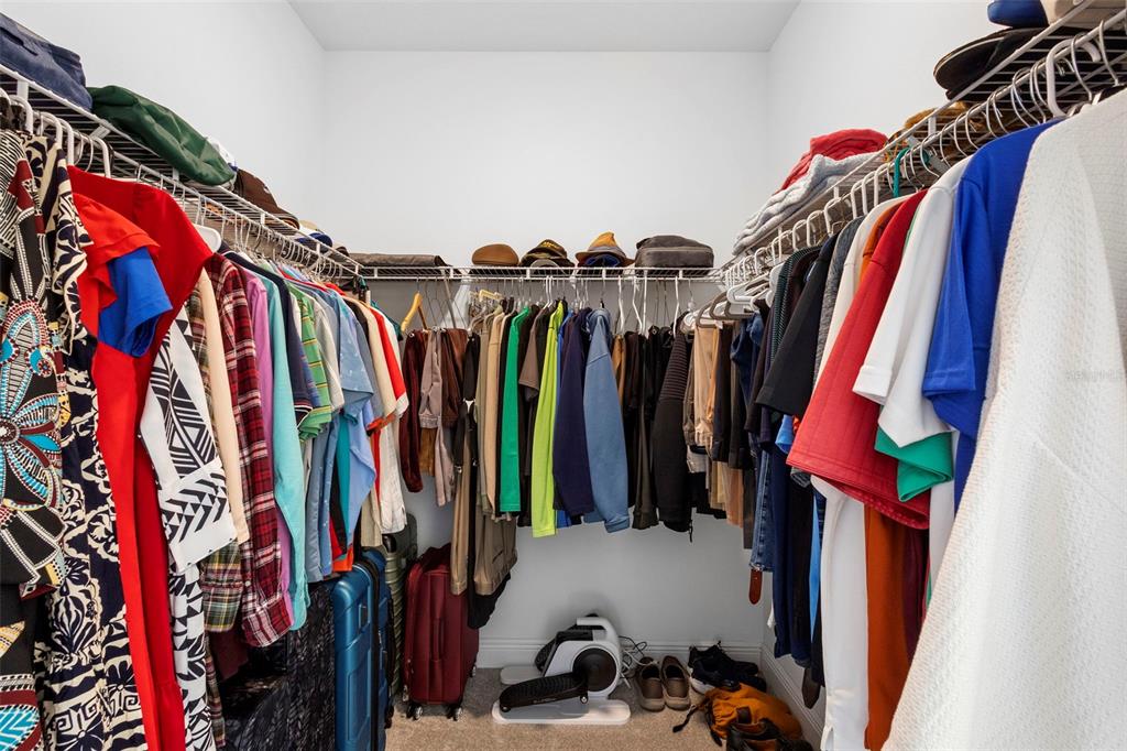 744 Hyperion Drive DeBary, FL 32713 - Photo 23 of 54 a view of walk in closet with clothes