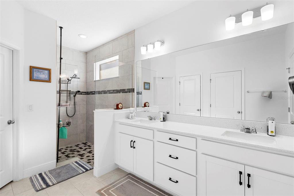 744 Hyperion Drive DeBary, FL 32713 - Photo 25 of 54 a bathroom with a sink a toilet and shower