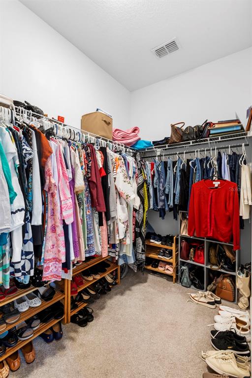 744 Hyperion Drive DeBary, FL 32713 - Photo 27 of 54 a view of walk in closet with clothes