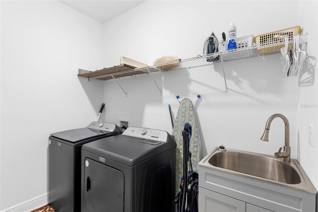744 Hyperion Drive DeBary, FL 32713 - Photo 28 of 54 a utility room with dryer and washer