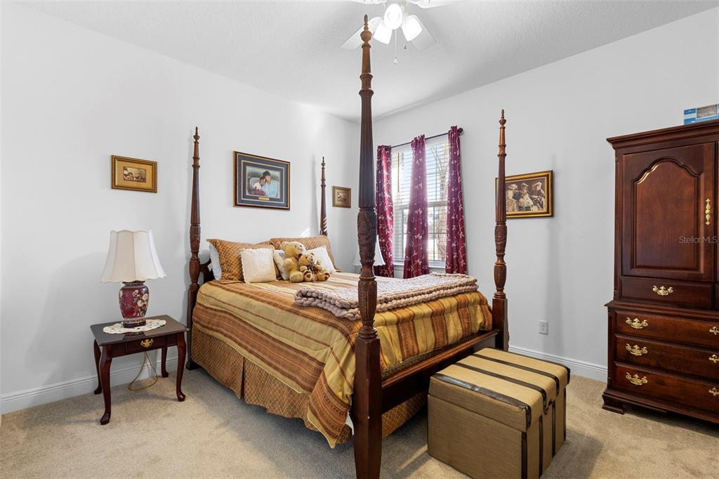 744 Hyperion Drive DeBary, FL 32713 - Photo 29 of 54 a bed room with a bed and a television