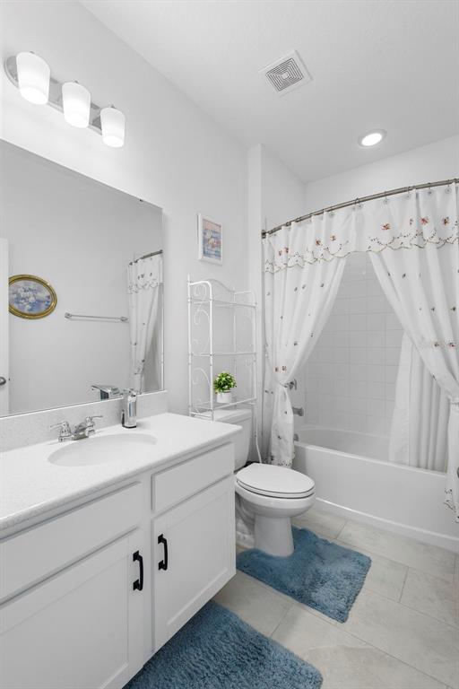 744 Hyperion Drive DeBary, FL 32713 - Photo 33 of 54 a bathroom with a sink a toilet and a mirror