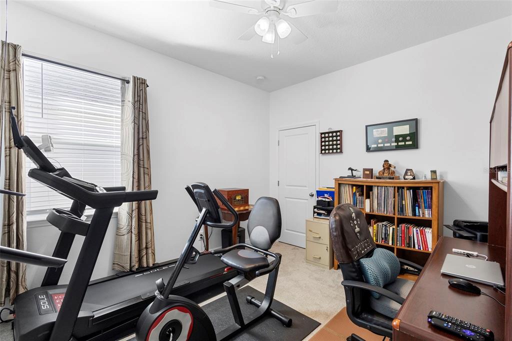 744 Hyperion Drive DeBary, FL 32713 - Photo 35 of 54 a living room with furniture and a book shelf