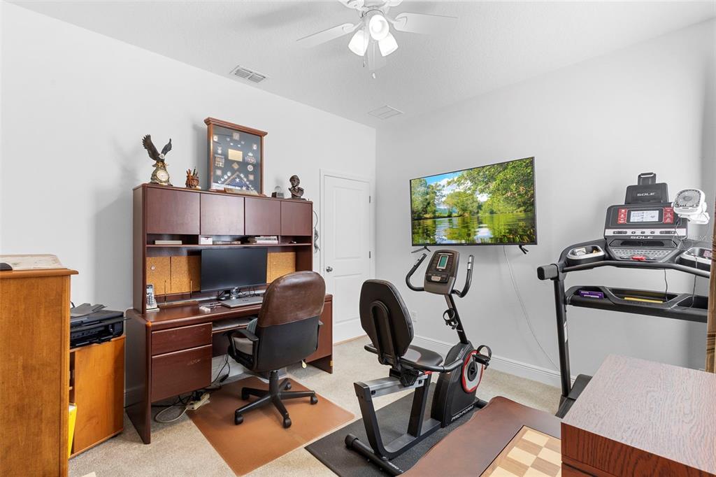 744 Hyperion Drive DeBary, FL 32713 - Photo 36 of 54 a view of a workspace with furniture and a window