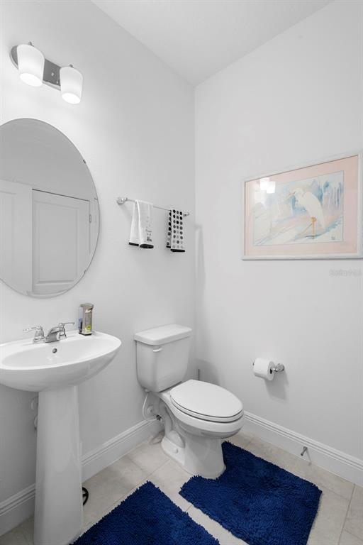 744 Hyperion Drive DeBary, FL 32713 - Photo 37 of 54 a bathroom with a toilet a sink and mirror