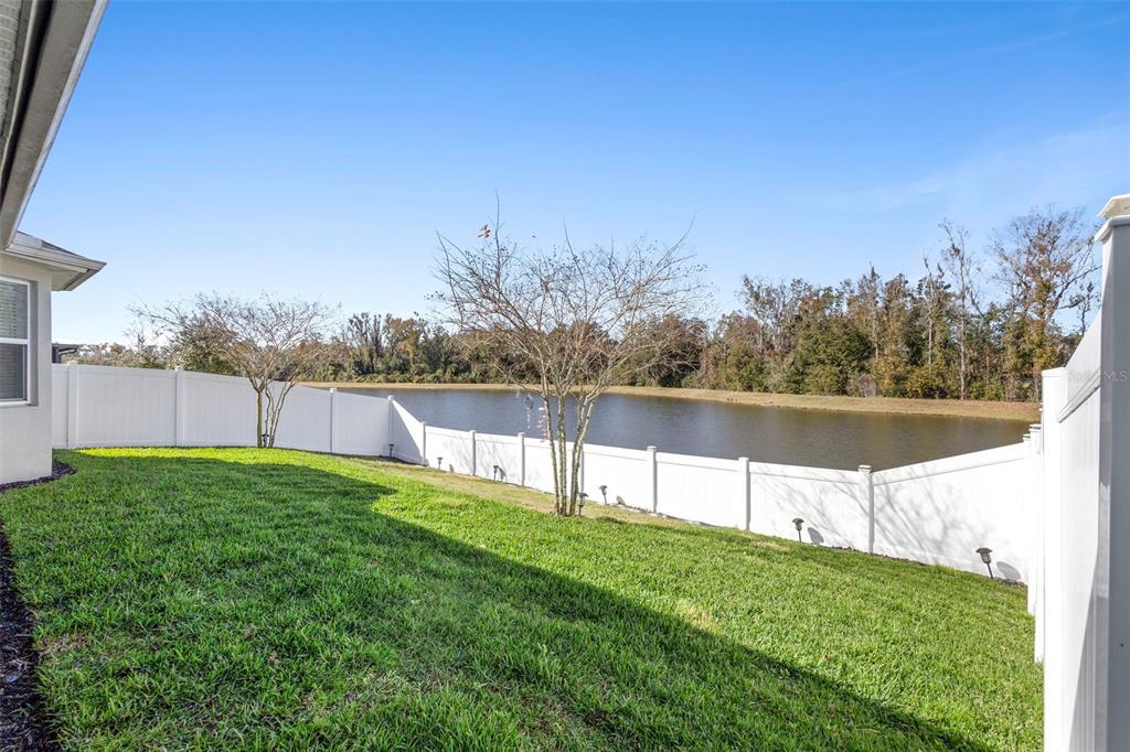 744 Hyperion Drive DeBary, FL 32713 - Photo 41 of 54 a view of yard with swimming pool and trees in the background